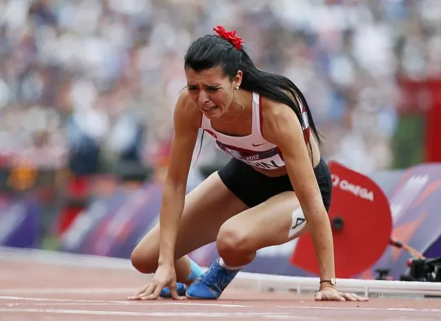 Turkey's Merve Aydin cries after she came in last in her women's 800m round 1 heat at the London 2012 Olympic Games at the Olympic Stadium August 8, 2012. (Photo by Lucy Nicholson/Reuters)