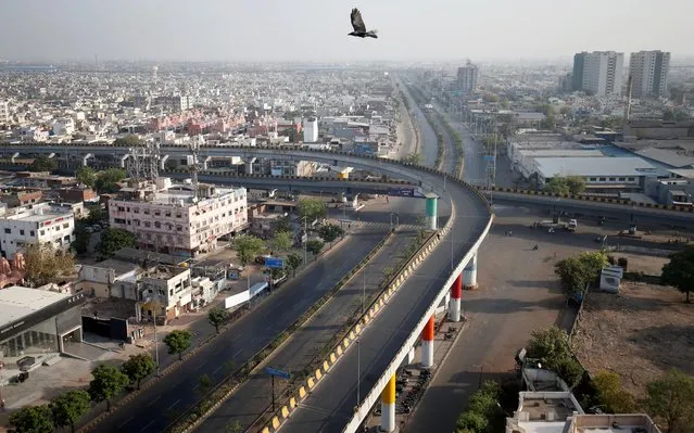 A view shows empty roads during a 14-hour long curfew to limit the spreading of coronavirus disease (COVID-19) in the country, in Ahmedabad, India, March 22, 2020. (Photo by Amit Dave/Reuters)