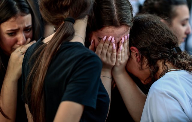 Friends and family members mourn during the funeral of the British-Israelis Lianne Sharabi and her daughters Noiya Sharabi, 16, and Yahel Sharabi, 13, in Kfar Harif, Israel on October 25, 2023. Sharabi and her daughters were killed by Hamas gunmen; her husband Eli is missing. More than 5,500 Palestinians and over 1,400 Israelis have been killed, according to the Israel Defense Forces (IDF) and the Palestinian health authority, since Hamas militants launched an attack against Israel from the Gaza Strip on 07 October 2023, and the Israeli operations in Gaza and the West Bank which followed it. (Photo by Hannibal Hanschke/EPA/EFE/Rex Features/Shutterstock)
