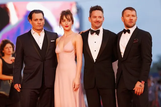 Johnny Depp, Dakota Johnson, director Scott Cooper and Joel Edgerton attend a premiere for “Black Mass” during the 72nd Venice Film Festival at  on September 4, 2015 in Venice, Italy. (Photo by Tristan Fewings/Getty Images)