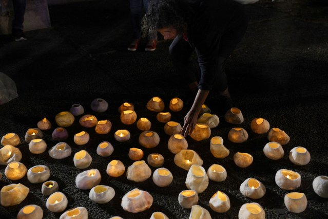 Families of hostages and supporters hold a candle vigil, calling for the release of hostages kidnapped on the deadly October 7 attack by Palestinian Islamist group Hamas, amid the ongoing conflict between Israel and Hamas, in Tel Aviv, Israel on December 21, 2023. (Photo by Violeta Santos Moura/Reuters)