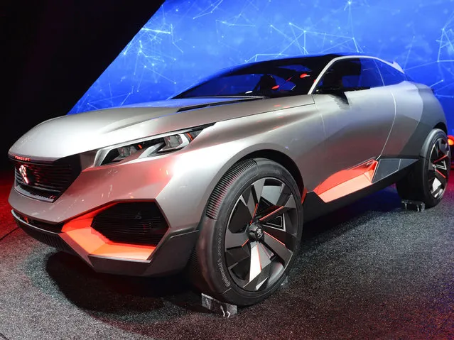The new Peugeot Concept Car Quartz is presented at the 2014 Paris Auto Show on October 2, 2014 in Paris on the first of the two press days. (Photo by Miguel Medina/AFP Photo)