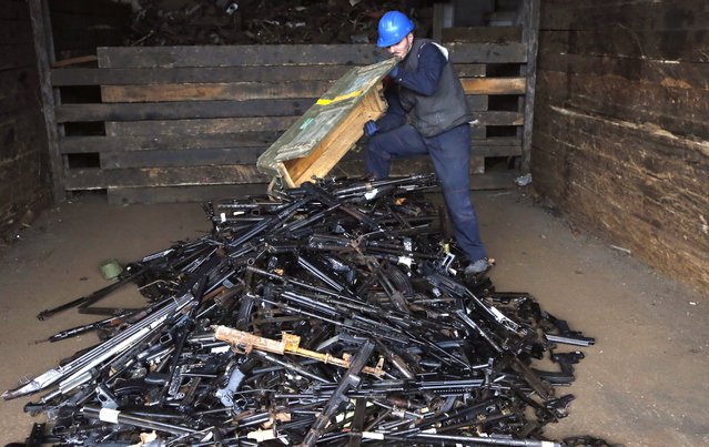 Workers prepare to destroy 2,490 pieces of collected and confiscated rifles, pistols and related equipment at the Ironworks in Ilijas, 25 km from Sarajevo, Bosnia and Herzegovina, 21 November 2022. The destruction action was organized by the coordination committee for the control of small arms and light weapons in Bosnia in cooperation with the European Union and the United Nations Development Program (UNDP) in Bosnia and Herzegovina and the Center for the Control of Small Arms and Light Weapons in Eastern and Southeastern Europe (SEESAC). (Photo by Fehim Demir/EPA/EFE)