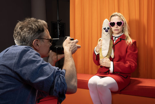 Photographer and artist, Miles Aldridge, takes on Tuesday, April 8, 2025 the first polaroid of fellow artist Lucy Sparrow to launch his special four-day polaroid portrait sessions at Sotheby’s London, with proceeds going to The Elton John AIDS Foundation.(Photo by Matt Alexander/PA Media Assignments)