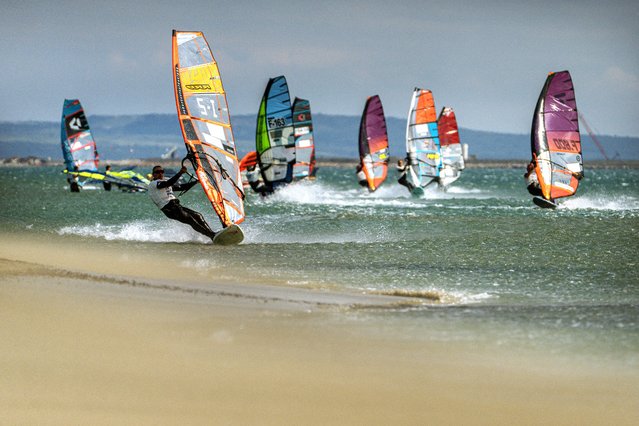 Kitesurfers compete in the “Prince of Speed” World Championship kitesurfing competition in La Palme, southwestern France, on April 27, 2025. (Photo by Idriss Bigou-Gilles/AFP Photo)