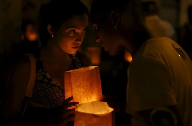 Catholic youths gather during a prayer vigil in front of Havana's cathedral September 18, 2015. (Photo by Carlos Garcia Rawlins/Reuters)