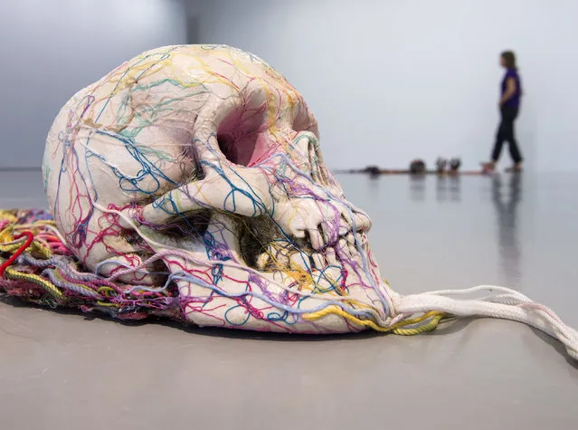 A woman walks behind the installation “Wandering boy is forever attractive” (1985) by Tetsumi Kudo during the press preview at the exhibition “Tetsumi Kudo – Retrospective” in the Fridericianum in Kassel, Germany, Friday, September 23, 2016. The exhibition offers an in-depth, comprehensive view of works by the Japanese artist Kudo. It starts on Sept. 25, 2016 and lasts until Jan. 1, 2017. (Photo by Jens Meyer/AP Photo)