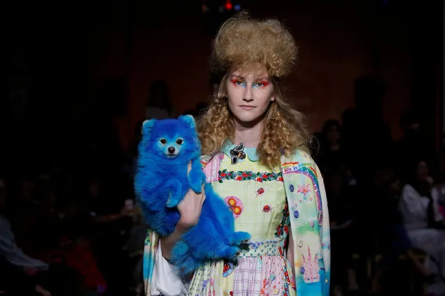 A model with a dog present a creation by Indian designer Manish Arora as part of his Spring/Summer 2017 women's ready-to-wear collection during Fashion Week in Paris, France September 29, 2016. (Photo by Gonzalo Fuentes/Reuters)