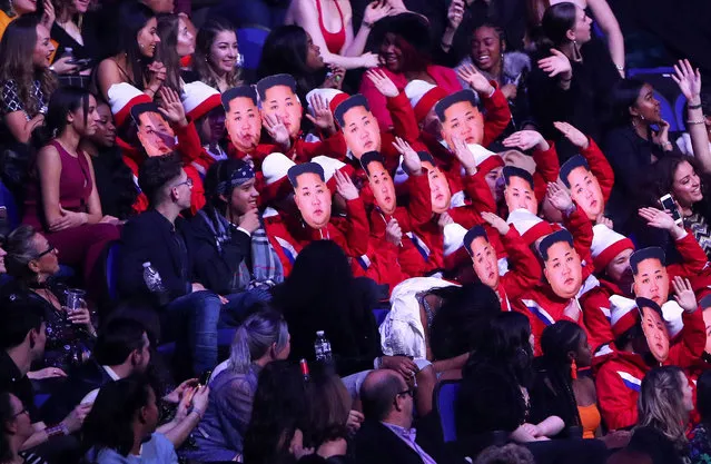Spectators wear Kim Jong-un masks as they impersonate the North Korean cheerleaders at the Winter Olympic Games at the Brit Awards at the O2 Arena in London, Britain, February 21, 2018. (Photo by Hannah McKay/Reuters)