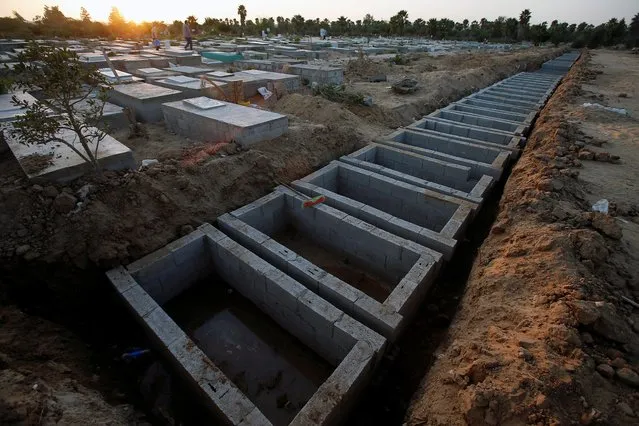 Graves dug for dead people, including the coronavirus disease (COVID-19) victims, are seen at a cemetery, east of Gaza City on September 22, 2020. (Photo by Suhaib Salem/Reuters)