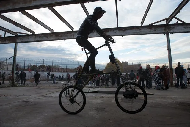 A man rides a tall bike during "Bike Kill 12" in the Brooklyn borough of New York City, October 31, 2015. (Photo by Stephanie Keith/Reuters)