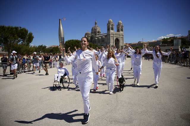 Maria Vysotchanska of Ukraine participates in the Olympic torch relay in Marseille, southern France, Thursday, May 9, 2024. Torchbearers are to carry the Olympic flame through the streets of France' s southern port city of Marseille, one day after it arrived on a majestic three-mast ship for the welcoming ceremony. (Photo by Daniel Cole/AP Photo)