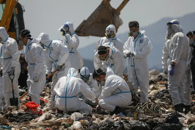 Police officers comb through garbage, searching for the remains of murdered model and influencer Abby Choi in a landfill site in Hong Kong, China, 28 February 2023. Choi's gruesome murder came to light last week after police found two severed legs, believed to be hers, inside a flat, followed by a skull and several ribs discovered in a large soup pot seized from the property. (Photo by Jerome Favre/EPA/EFE/Rex Features/Shutterstock)