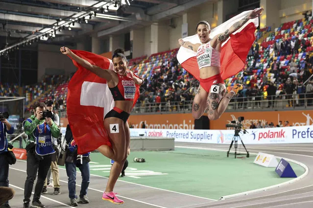 Gold medalist Mujinga Kambundji, of Switzerland, left, and silver medalist Ewa Swoboda, of Poland, celebrate after finishing the Women 60 meters final at the European Athletics Indoor Championships at Atakoy Arena in Istanbul, Turkey, Friday, March 3, 2023. (Photo by AP Photo/Stringer)