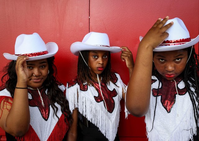 Sarai Howard Johnson, Zamirah Chadwick and Sydnee Littleton, from the Self Enhancement Inc. dance group, pose before performing at the 8 Seconds Juneteenth Rodeo in Portland, Oregon, on Sunday, June 16, 2024. (Photo by Abigail Dollins/Statesman Journal/USA Today Network)