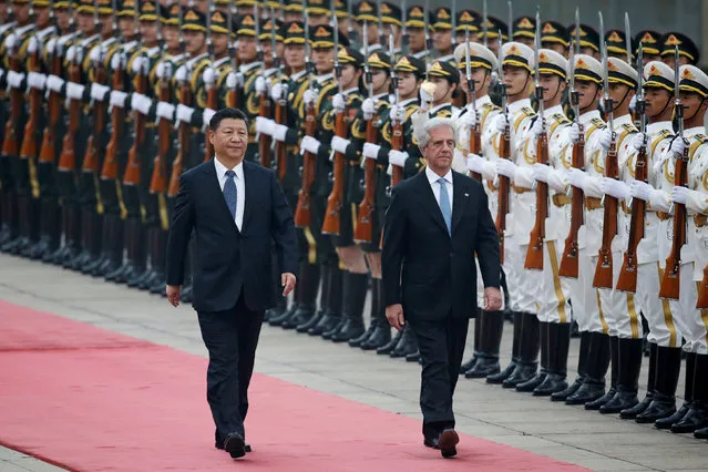 China's President Xi Jinping and Uruguay's President Tabare Vazquez review honour guards during a welcoming ceremony at the Great Hall of the People in Beijing, China, October 18, 2016. (Photo by Jason Lee/Reuters)