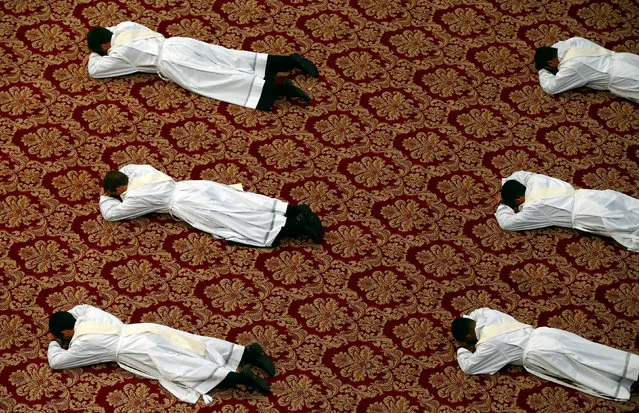 Newly ordained priests lie on the floor as Pope Francis leads a mass in Saint Peter's Basilica at the Vatican, April 22, 2018. (Photo by Tony Gentile/Reuters)