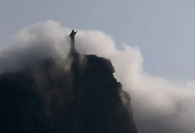 Christ the Redeemer statue is seen in the early morning fog during 2016 Rio Olympics, Rio De Janeiro, Brazil August 9, 2016. (Photo by Carlos Barria/Reuters)