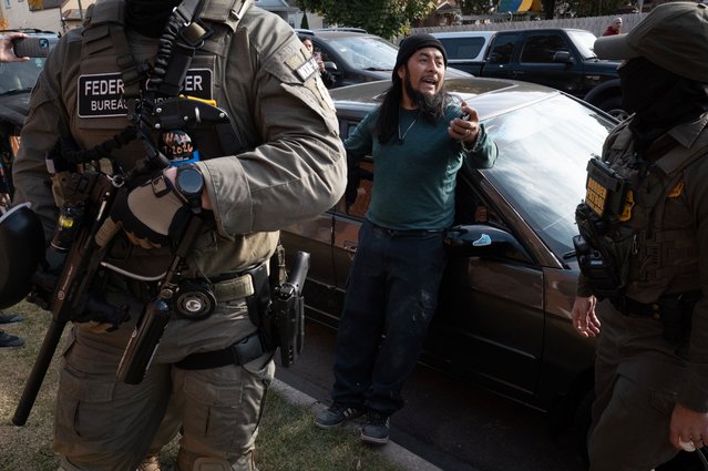 Federal agents stop a resident and request to see proof of citizenship on November 06, 2025 in Chicago, Illinois. The man produced the required documents and was allowed to go free. Federal agents participating in Operation Midway Blitz are conducting daily patrols through Chicago neighborhoods and surrounding suburbs searching for undocumented immigrants. (Photo by Scott Olson/Getty Images)