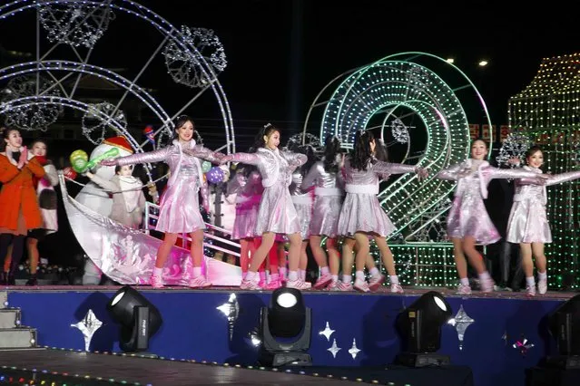 Dancers perform during celebrations to mark the New Year, at Kim Il Sung Square in Pyongyang, North Korea, early Friday, January 1, 2021. (Photo by Jon Chol Jin/AP Photo)