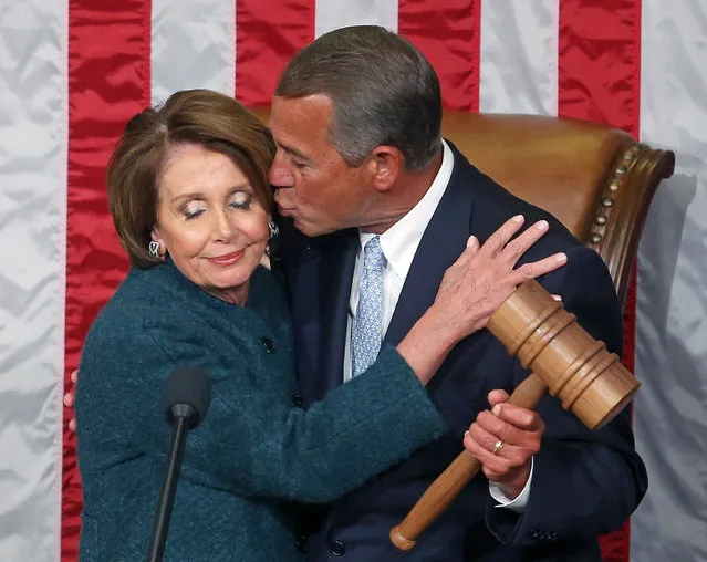 House Minority Leader Nancy Pelosi (D-CA) (L) is kissed by Speaker of the House John Boehner (R-OH) as he is handed the speaker's gavel during the first session of the 114th Congress in the House Chambers January 6, 2015 in Washington, DC. Today Congress convened its first session of the 114th Congress with Republicans controlling both the House and Senate. (Photo by Mark Wilson/Getty Images)