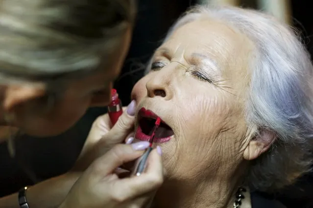 Holocaust survivor Hava Hershkovitz, 82, a previous beauty queen in the competition, has her make-up done during preparations ahead of a beauty contest for survivors of the Nazi genocide in the northern Israeli city of Haifa November 24, 2015. (Photo by Amir Cohen/Reuters)