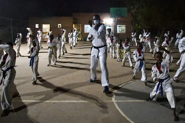World champion and Olympic vice-champion, Niger's taekwondoist Abdoulrazal Alfaga gives a taekwondo class, on December 22, 2020, in Niamey, Niger. Abdoulrazak Alfaga became an idol in Niger at the age of 26 after practicing his sport in secret. He is aiming for gold next summer in Tokyo to become the first Olympic champion of his country, one of the poorest in the world. (Photo by Issouf Sanogo/AFP Photo)