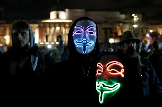 Mask wearing protesters gather before the “Million Mask March” in London, Britain November 5, 2016. (Photo by Peter Nicholls/Reuters)