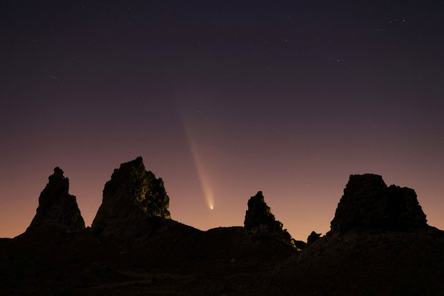 Comet Tsuchinshan-ATLAS, C/2023, with an 80,000 year orbit, passes behind geological formations, tufa spires at Trona Pinnacles, California, U.S. October 12, 2024. (Photo by David Swanson/Reuters)