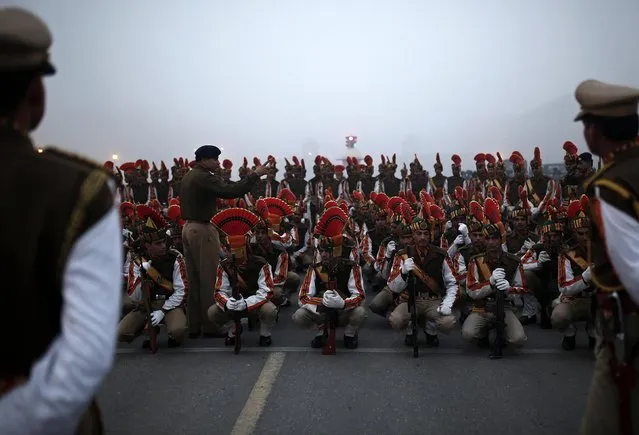 Indian soldiers listen to their instructor during the rehearsal for the Republic Day parade on a foggy winter morning in New Delhi January 16, 2015. (Photo by Ahmad Masood/Reuters)