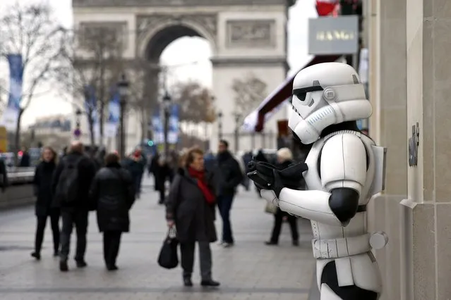 A Storm Trooper is pictured on the Champs Elysees avenue the day before the release of the film “Star Wars: The Force Awakens” in Paris, France, December 15, 2015. (Photo by Benoit Tessier/Reuters)