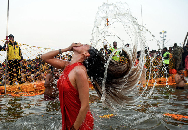 An Akhada member takes “Amrit Snan” at Triveni Sangam on the occasion of “Basant Panchami”, during the ongoing Mahakumbh 2025, in Prayagraj, India on Monday, on February 3, 2025. (Photo by ANI Photo/Ishant)