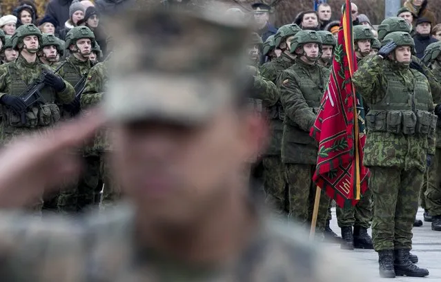 Lithuanian soldiers attend a celebration of the 98th anniversary of the country's military on Armed Forces Day at Cathedral Square in Vilnius, Lithuania, Wednesday, November 23, 2016.  For Lithuanians, the holiday honours the restoration of Lithuania's armed forces in 1918 after the end of WWI. (Photo by Mindaugas Kulbis/AP Photo)