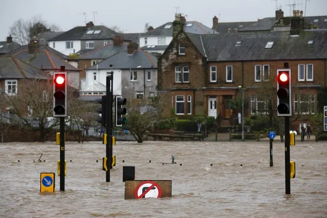 A flooded street is pictured in Dumfries, Scotland December 30, 2015. (Photo by Darren Staples/Reuters)