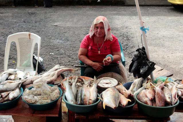 A woman sells fish in the market after Hurricane Otto hit southern Nicaragua at Bluefields, Nicaragua November 25, 2016. (Photo by Oswaldo Rivas/Reuters)