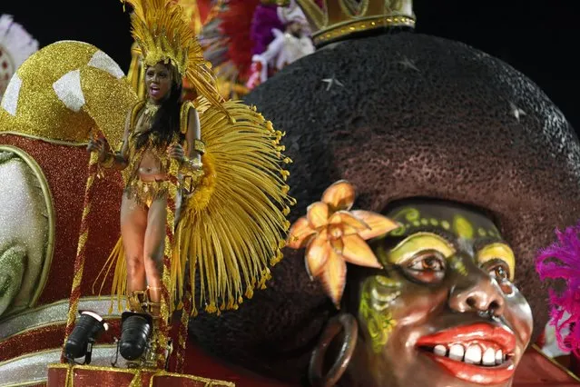 A reveller from the Alegria da Zona Sul samba school takes part in the Group A category of the annual Carnival parade in Rio de Janeiro's Sambadrome, February 14, 2015. (Photo by Pilar Olivares/Reuters)