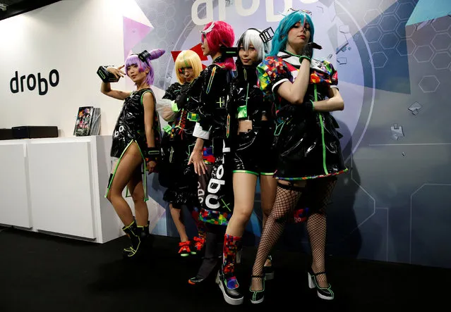 Women dressed in costumes pose for a photograph at Tokyo Comic Con at Makuhari Messe in Chiba, Japan December 2, 2016. (Photo by Issei Kato/Reuters)