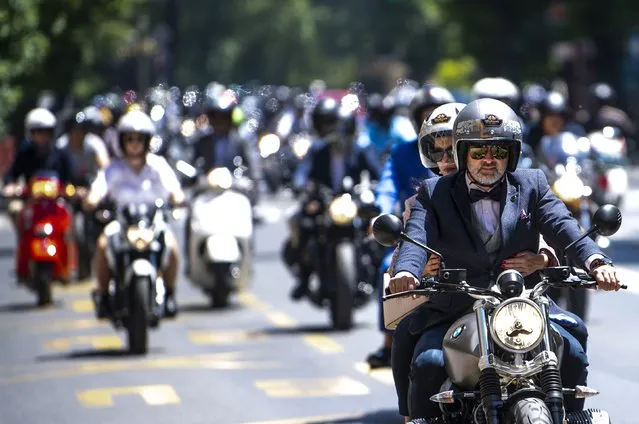 The participants of “The Distinguished Gentleman's Ride” ride their motorcycles through the streets in Skopje, Republic of North Macedonia, 23 May 2021. North Macedonia is officially taking part in the world's largest charitable on-road event for owners of classic and vintage styled. This year's event celebrates 10 years of the Distinguished Gentleman's Ride. The Distinguished Gentleman's Ride is a global motorcycle event raising funds and awareness for prostate cancer research and men's mental health programs on behalf of the Movember Foundation. (Photo by Georgi Licovski/EPA/EFE)