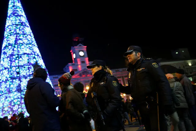 Police officers patrol before the start of New Year's celebrations at Puerta del Sol square in central Madrid, Spain December 31, 2016. (Photo by Susana Vera/Reuters)