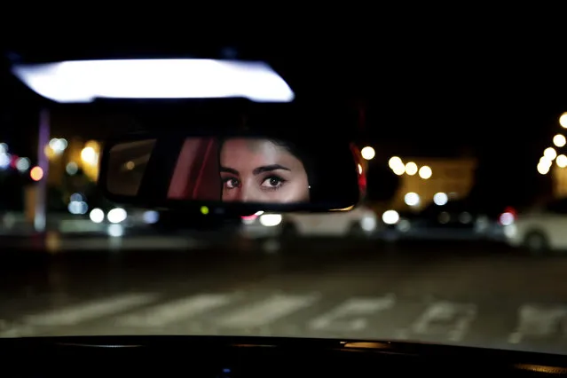 Hessah al-Ajaji drivers her car down the capital's busy Tahlia Street after midnight for the first time in Riyadh, Saudi Arabia, Sunday, June 24, 2018. Saudi women are in the driver's seat for the first time in their country and steering their way through busy city streets just minutes after the world's last remaining ban on women driving was lifted on Sunday. (Photo by Nariman El-Mofty/AP Photo)