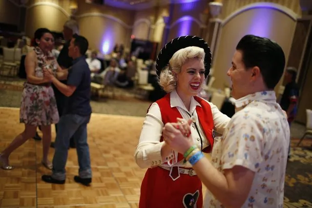 In this April 4, 2015, photo, Zack Simpson, right, and Dollie Simpson dance during a jive class at the Viva Las Vegas Rockabilly Weekend in Las Vegas. Dance classes were held for Bopping, Jiving, Strolling and the Texas Two-Step. (Photo by John Locher/AP Photo)