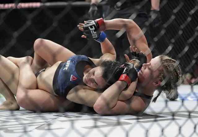 Paige Vanzant, right, punches Rachael Ostovich during the second round of a women's flyweight mixed martial arts bout at UFC Fight Night Saturday, January 19, 2019, in New York. Vanzant stopped Ostovich in the second round. (Photo by Frank Franklin II/AP Photo)