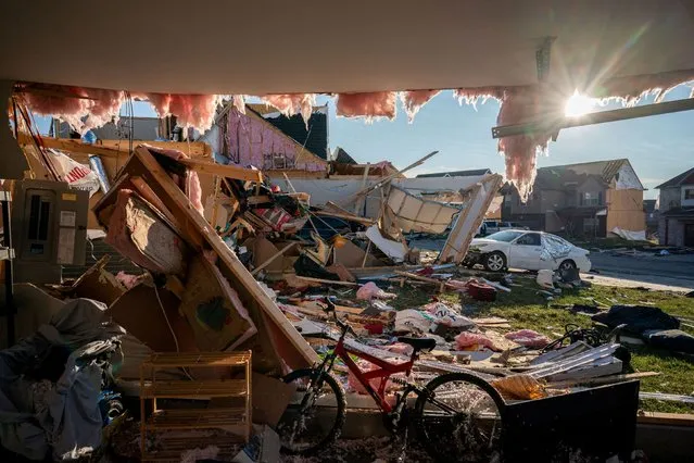 Debris spills from a damaged home after a tornado stuck Clarksville, Tennessee, U.S. December 10, 2023. (Photo by Andrew Nelles/USA Today Network via Reuters)