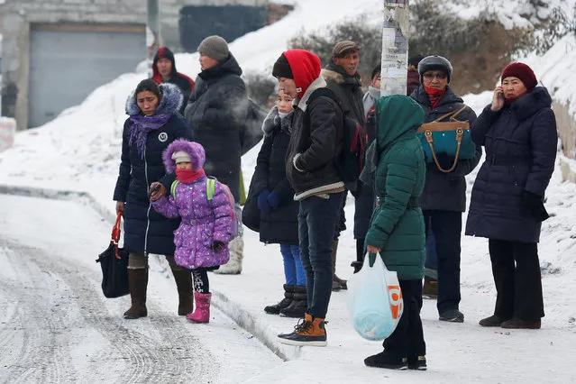 People wait for the bus in Ulaanbaatar, Mongolia as the wave of extreme cold hits the country December 22, 2016. Picture taken December 22, 2016. (Photo by B. Rentsendorj/Reuters)