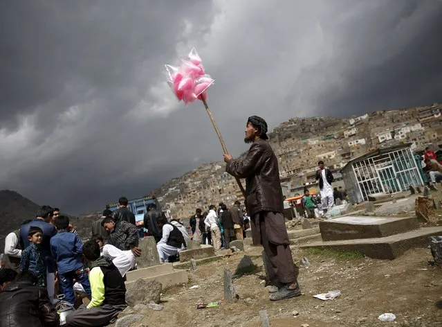 An Afghan man sells sweets during  the celebration for Afghan New Year (Newroz) in Kabul, Afghanistan March 20, 2016. (Photo by Ahmad Masood/Reuters)