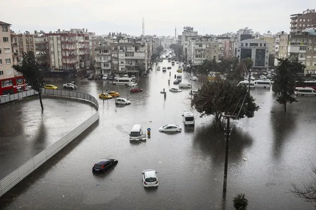 Vehicle are scattered during floods after heavy rains in Antalya, southern Turkey, Tuesday, February 13, 2024. (Photo by Dia Images via AP Photo)