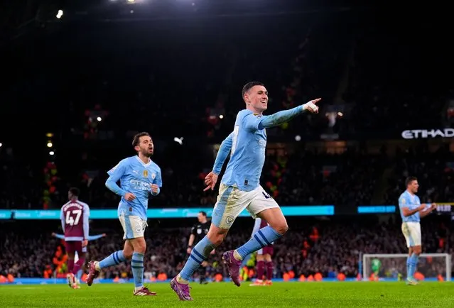 Manchester City's Phil Foden celebrates scoring their side's third goal of the game during the Premier League match at the Etihad Stadium, Manchester on Wednesday, April 3, 2024. (Photo by Martin Rickett/PA Images via Getty Images)