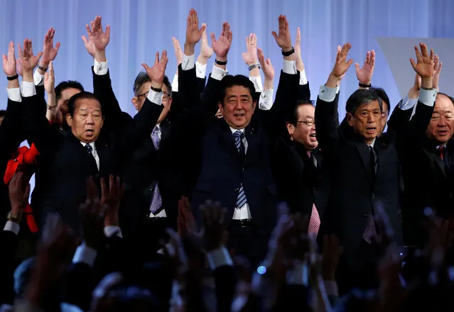 Japan's Prime Minister Shinzo Abe (C) shouts “Banzai!” (cheers) as he raises his hands with members of the ruling Liberal Democratic Party (LDP) during the annual party convention in Tokyo, Japan, March 5, 2017. (Photo by Toru Hanai/Reuters)