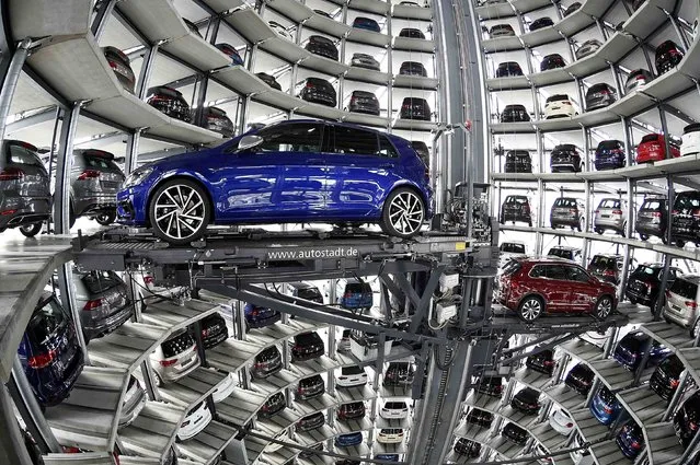VW Golfs are loaded in a delivery tower at the plant of German carmaker Volkswagen in Wolfsburg, Germany, March 14, 2017. The CEO of German automaker Volkswagen says the United States remains a “core market” for the company despite its diesel emissions scandal and has underlined that it hopes to expand there. Matthias Mueller made the comments Tuesday at the company's annual news and investor conference at its headquarters in Wolfsburg, Germany. (Photo by Fabian Bimmer/Reuters)