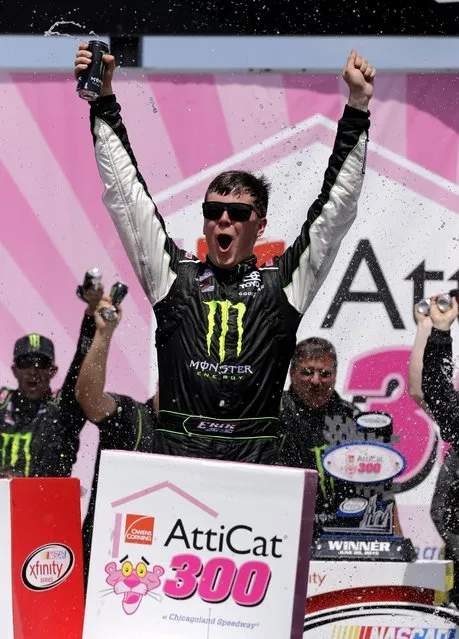 Erik Jones celebrates with his crew in Victory Lane after winning the NASCAR Xfinity series auto race at Chicagoland Speedway, Sunday, June 21, 2015, in Joliet, Ill. (AP Photo/Nam Y. Huh) 